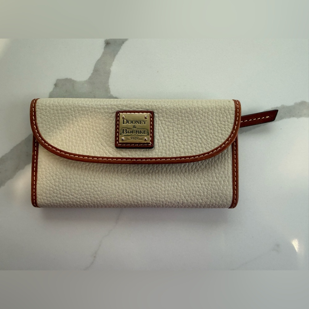 Dooney & Bourke Cream Pebble Leather Wallet with Brown Trim and Brass Plaque
